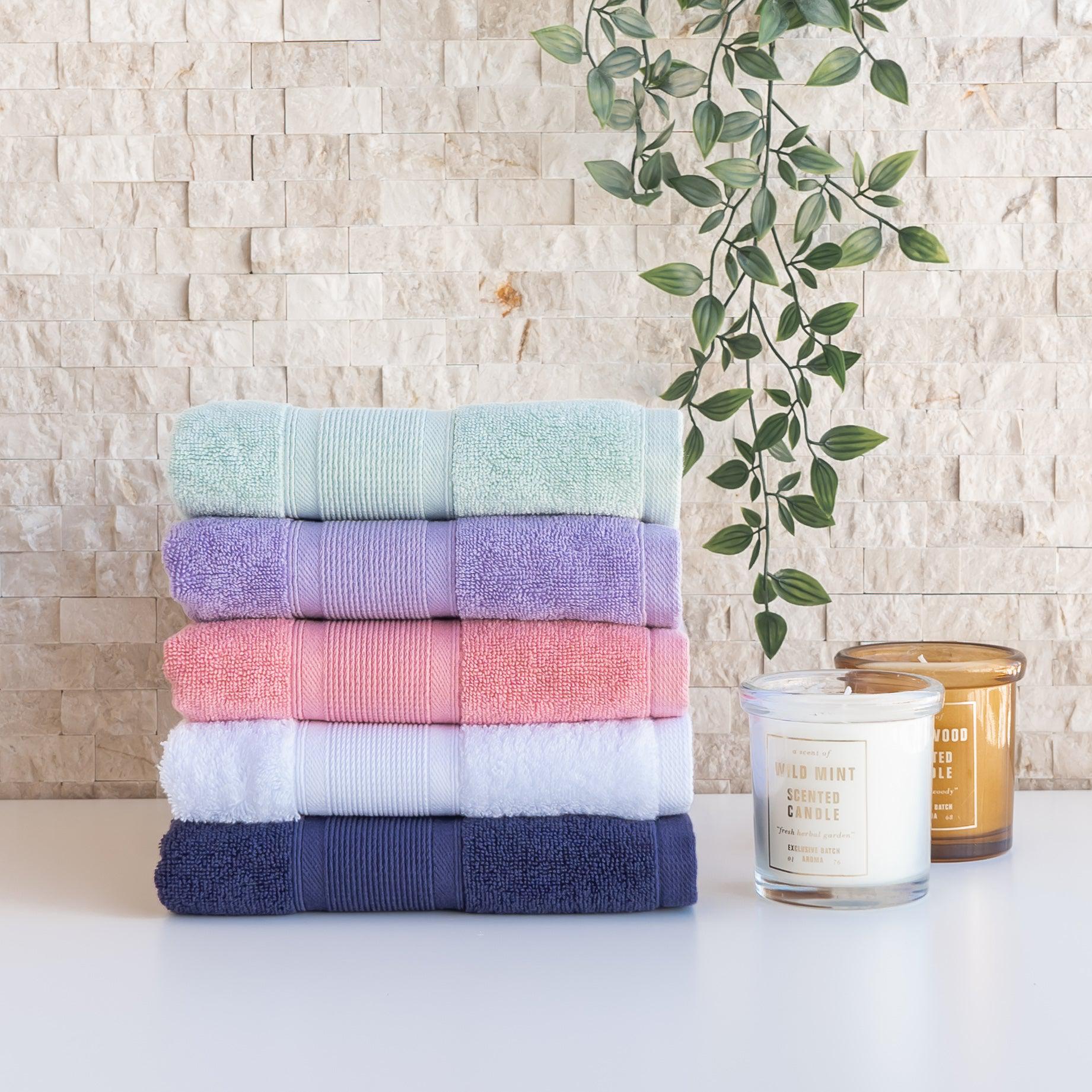 Stack Of Neatly Folded Colorful Kitchen Towels, On White