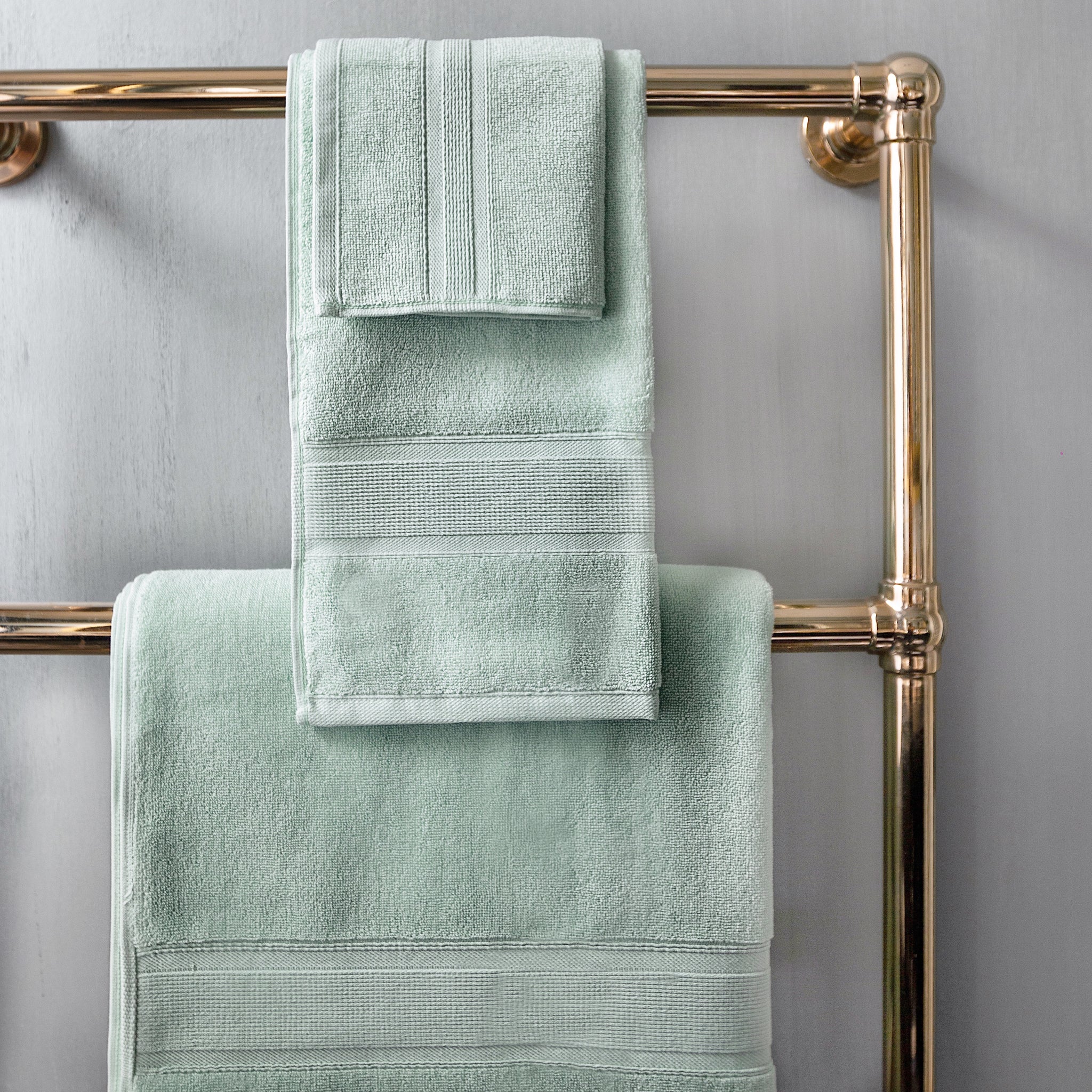 Bathroom inspiration. Green bathroom shower tile with wooden towel rack / drying  rack from Target with Turkish towels from Homegoods. #greenshowert…